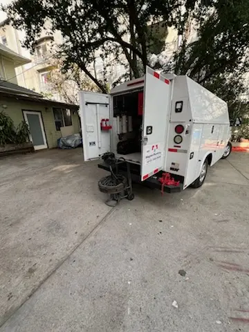 Magnet Plumbing service vehicle on-site for Grease Trap Cleaning in Opportunity